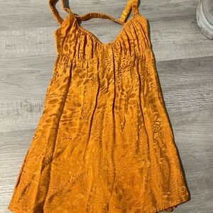 Isabella’s closet, orange and gold size small backless dress